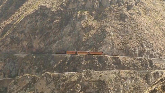 Experience the thrill of riding the Ecuadorian train through the challenging route of Nariz del Diablo,a highly sought after tourist attraction in the Andes.
