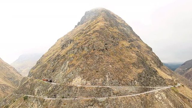 Experience the breathtaking Ecuadorian train journey as it passes through the iconic Nariz del Diablo,offering a mesmerizing time lapse view of the train's incredible turnaround.