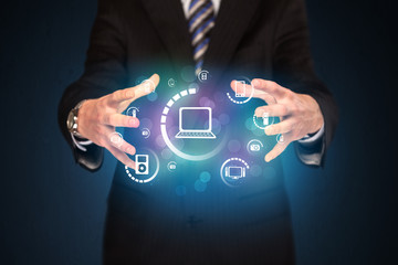 holding digital media icons