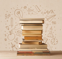 A pile of books on table with school hand drawn doodle sketches