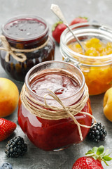 Strawberry, peach and blueberry jams