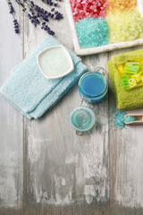 Colorful spa cosmetics on wooden table