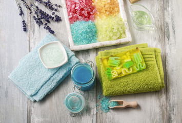 Colorful spa cosmetics on wooden table