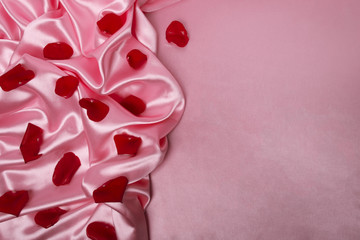 rose petals on the pink silk