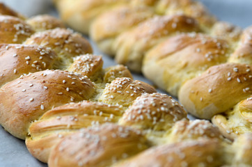 Fresh braided bread with sesame seeds