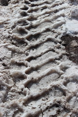  Tire track or tyre tread marks in freshly fallen snow. 