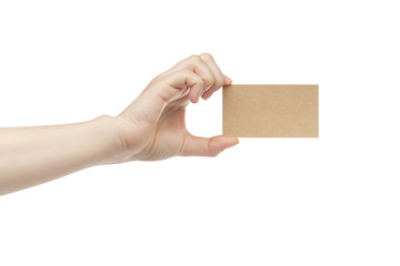 young female right hand hold blank brown paper card, isolated on white