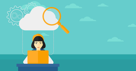 Woman working on laptop.