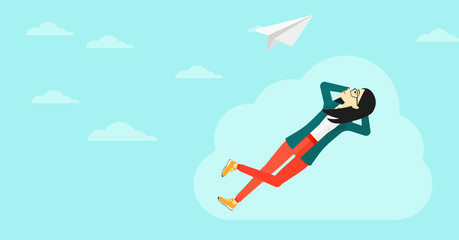 Business woman relaxing on cloud.
