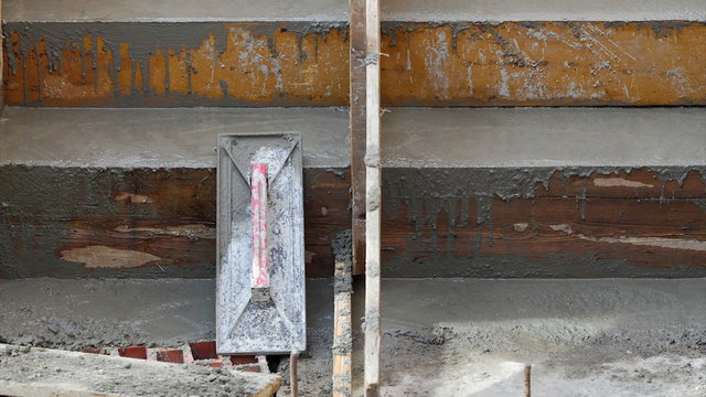Concrete staircase at construction site and trowel  zoom out HD footage