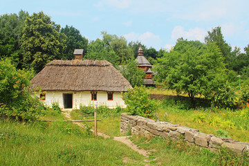 Fototapeta na wymiar Old traditional house and church in Ukraine