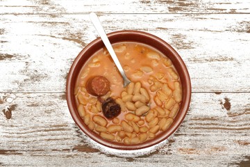 Asturian bean stew in a clay pot.