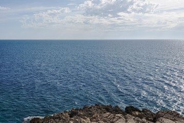 Fototapeta na wymiar Sea calm surface and blue cloud sky. Horizon. Bay Gertsegnovska in Adriatic