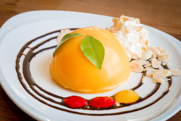 Delicious orange cake on plate