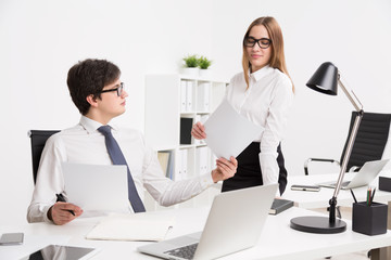 Obraz premium Businessman and businesswoman in office