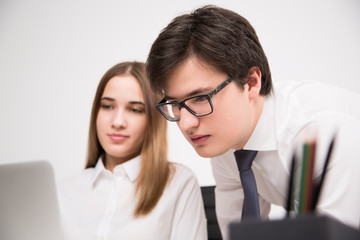 Businessman and businesswoman in office
