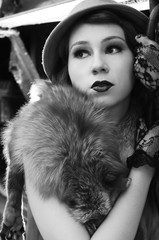 Beautiful fashion woman in retro clothes with locomotive