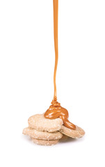 sweet caramel sauce is poured on a cookies