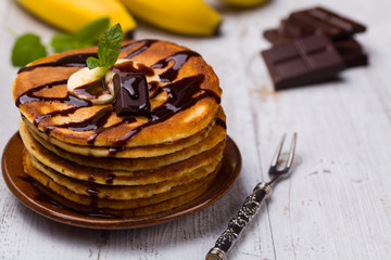 Delicious pancakes with bananas and chocolate.