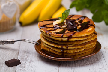 Delicious pancakes with bananas and chocolate.