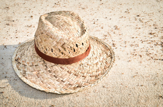 Straw hat on a tropical beach, Close up image