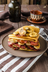 Pancakes with bacon, banana and maple sirup