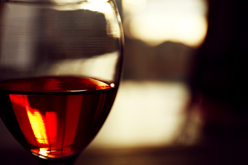 Glass of red wine on blurred background