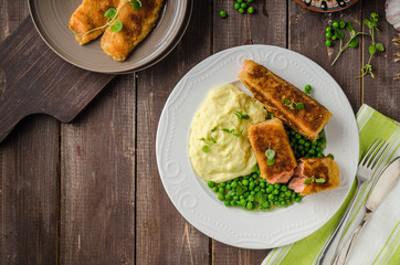 Fried salmon with mashed potato and vegetable