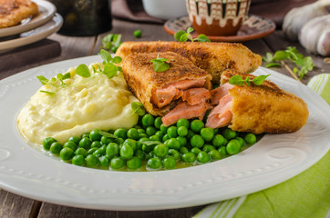 Fried salmon with mashed potato and vegetable