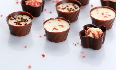 Assorted chocolate candies, isolated on white