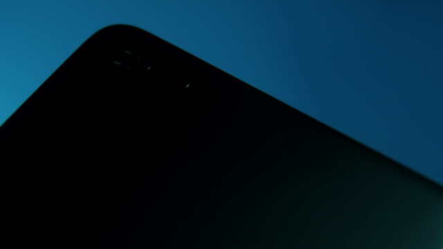 Closeup of Smartphone Camera Module on the back, placed on blue gradient background