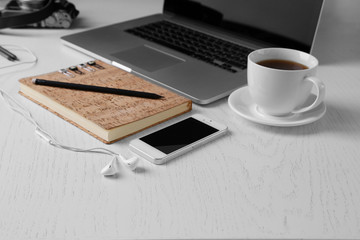 Office table with supplies and gadgets