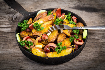 Fried potatoes with sausages