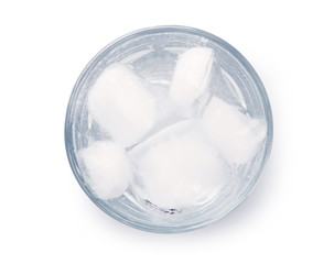 Glass of water with ice blocks isolated on white background, top view