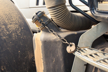 closeup petrol tank of tractor with pad-lock