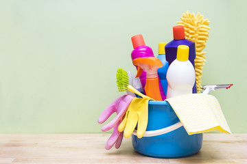 House cleaning product on wood table with green background © tatomm