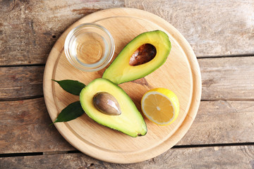 Fresh avocados  on wooden board, close up