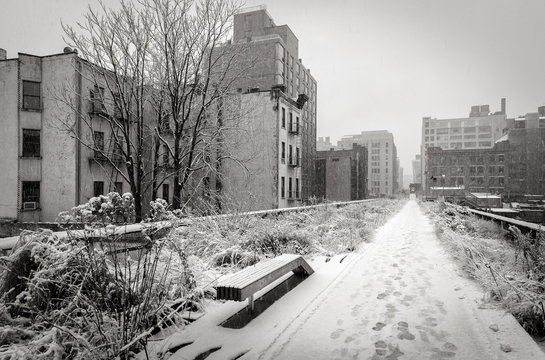 Black & White view of the High Line covered in snow after winter snowstorm. Chelsea, Manhattan, New York City