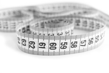 Measuring tape on white background