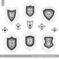 Set of different geometric shields with light ray. Hipster vintage style templates for business signs, labels, logos, identity, badges, apparel, shirts, stickers and other branding objects