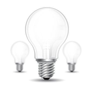 Three realistic mock up light bulb or lamp on white background. Vector illustration one bolb sharp and two bulbs depth of field