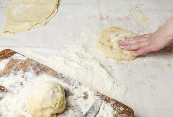 Making dough by female hands
