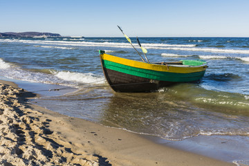 Naklejka premium Old wooden boat fishermen.