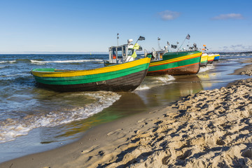 Naklejka premium Colorful fishing vessels on the sea.