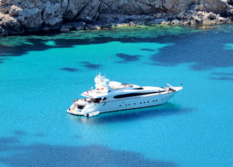 boat anchored in a bay, luxury yacht - obrazy, fototapety, plakaty