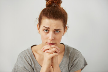 Portrait closeup funny confused skeptical woman girl female thinking looking at camera isolated...