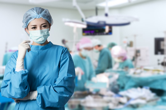 Asian Woman Surgeon In Operation Room