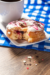 Breakfast with glazed donut and coffee cup