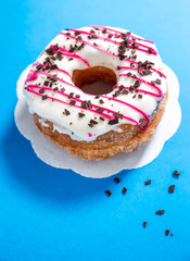 Glazed donut with chocolate pieces