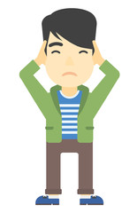 Man clutching his head in desperate.